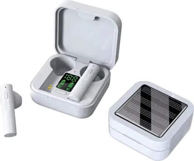 A pair of white wireless earbuds and their charging case are displayed against a white background. The charging case is open, showing the earbuds inside and a digital display on the case. A separate charging case with a solar panel on top is also shown.