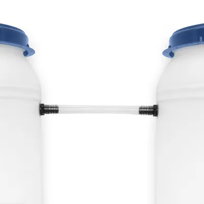 Two white barrels connected by a clear tube.