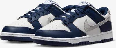 A pair of Nike Dunk Low sneakers shown from a diagonal angle against a white background.