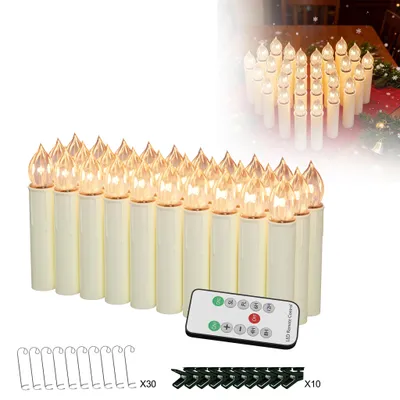 A collection of LED Christmas candles with a remote control and accessories.