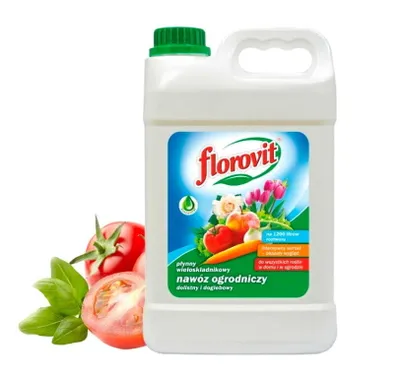A bottle of Florovit garden fertilizer is shown next to some fresh tomatoes and basil.