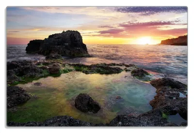 Produktbild von Wallario Frühstücksbrettchen aus Glas 20 x 30 cm mit rutschfesten Füßen, Motiv Felsige Küste bei Sonnenuntergang