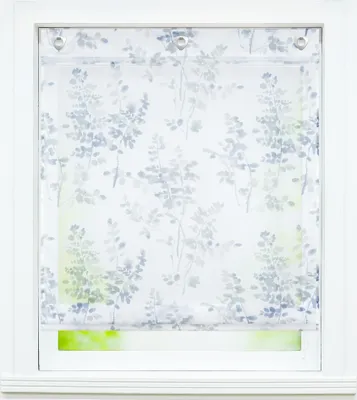 A window with a floral patterned roller blind.