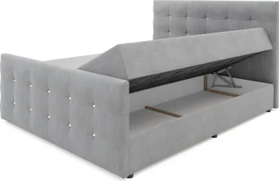 A grey upholstered bed frame with the storage compartment open, revealing the lift mechanism and interior space.