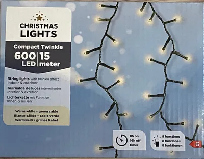 The image shows the packaging of a string of Christmas lights, with the lights themselves draped over the box.