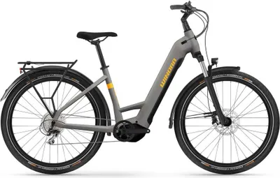 A studio shot of a gray electric bicycle against a white background.