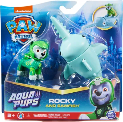 The image shows a toy set of Paw Patrol characters in their Aqua Pups gear, including Rocky and a sawfish vehicle, presented in its retail packaging.