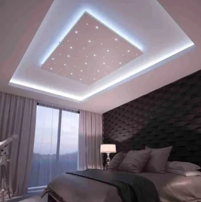 A bedroom with a star ceiling.