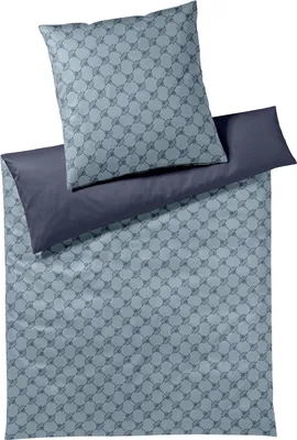 A folded duvet cover and pillowcase set with a geometric pattern.