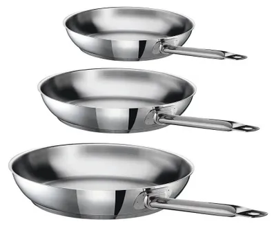 Three stainless steel frying pans are stacked on a white background.