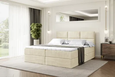 A bedroom scene with a bed, nightstand, and window.