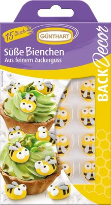 A package of decorative sugar bees for baking, shown with examples of their use on cupcakes.