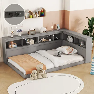 A child's bedroom with a grey corner sofa bed, decorated with toys and a rug.