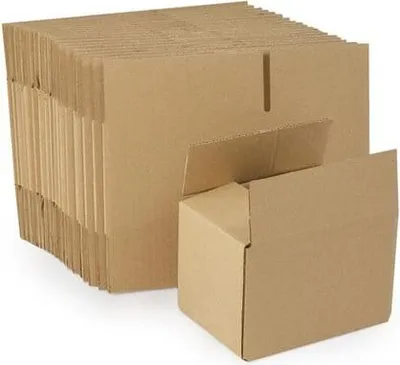 A stack of flat-packed cardboard boxes with one box partially assembled in the foreground.