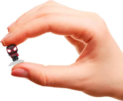 A hand holding a tiny Spider-Man Miles Morales figurine.