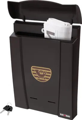 A dark brown plastic mailbox with a newspaper inside and two keys in the foreground.