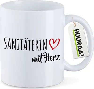 Produktbild von Huuraa Kaffeetasse Sanitäterin mit Herz 330ml Weiß Keramik Kaffeebecher Geschenkidee