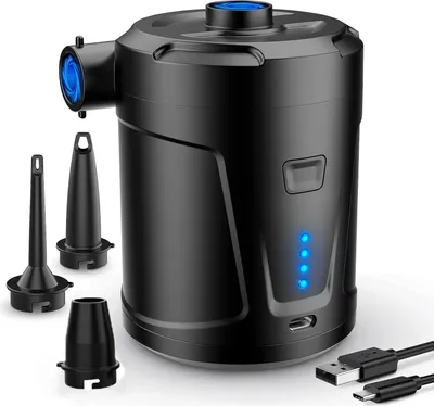 A black electric air pump with several nozzles and charging cables on a white background.
