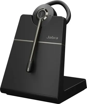 A black Jabra Engage 55 SE Convertible headset is shown on its charging base against a white background.