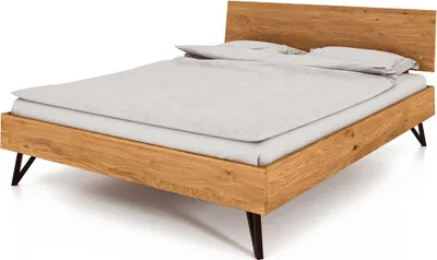 Produktbild von Bett Rolo 2 in 120x200 cm aus Wildeiche massiv mit Holzkopfteil und Metallbeinen
