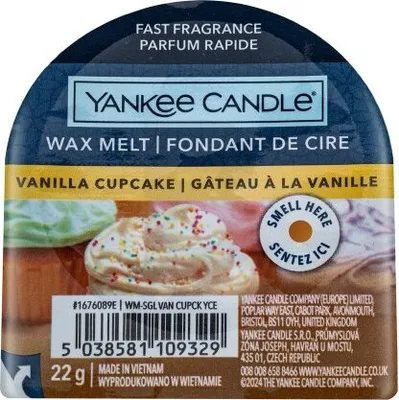 A close-up of a Yankee Candle wax melt packaging with a cupcake image.