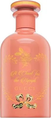 A studio shot of a pink Gucci perfume bottle with gold accents and text.