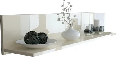 A cream-colored floating shelf with decorative items.