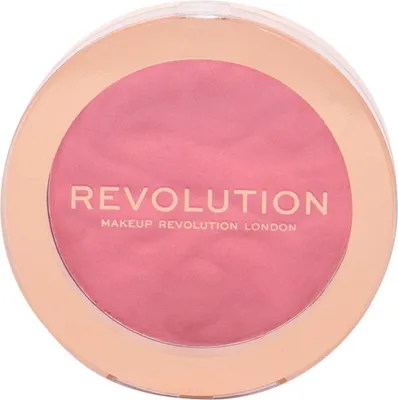 A round makeup compact with pink powder and gold trim.