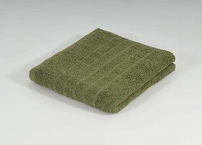A folded green towel on a white background.