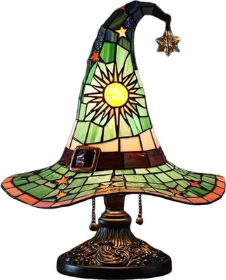 A stained glass lamp shaped like a witch's hat, displayed on a white background.