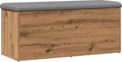 A storage bench with a wooden effect front and a gray upholstered top.