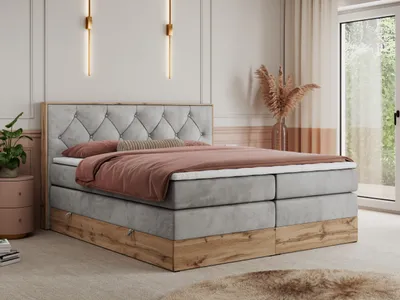 A bedroom scene with a bed as the focal point, decorated with soft furnishings and ambient lighting.