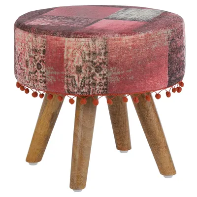 A round upholstered stool with wooden legs and a patchwork fabric cover.