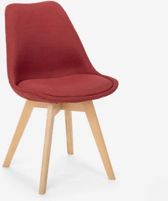 A red fabric chair with wooden legs on a white background.
