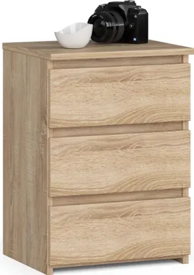 A wooden nightstand with three drawers is shown against a white background. A camera and a white bowl are placed on top of the nightstand.