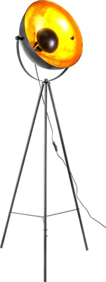 A black tripod floor lamp with a black exterior and a gold interior lampshade.