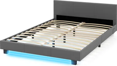 A gray upholstered bed frame with a slatted base and LED lighting underneath.