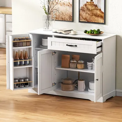 A white sideboard cabinet with its doors and drawer open, displaying its interior storage compartments and contents.