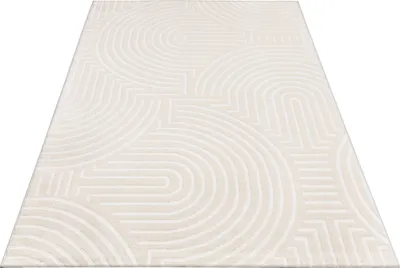 A cream-colored rug with a geometric pattern of arches and lines, shown from a diagonal perspective on a white background.