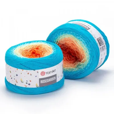Two balls of yarn with a gradient color pattern, displayed on a white background.