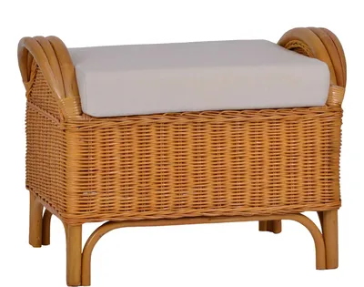A rattan ottoman with a beige cushion on a white background.