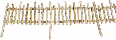 A decorative fence made of birch wood sticks, designed to be placed in a garden bed.