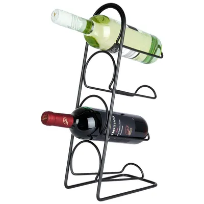A black metal wine rack holding two wine bottles, one white and one red, against a white background.