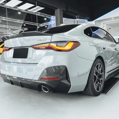 Immagine prodotto di Paraurti posteriore con diffusore, finitura nera lucida, realizzato in plastica ABS, compatibile con BMW Serie 4 G26 Gran Coupé M Sport