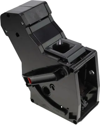 A black plastic component, likely from a coffee machine.