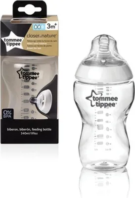 A Tommee Tippee feeding bottle and its packaging are displayed side-by-side against a white background.