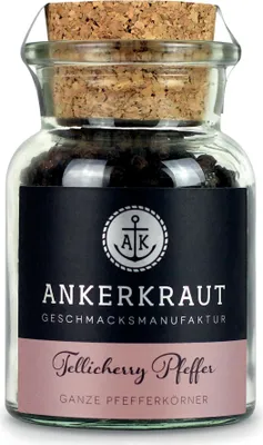 A glass jar of Tellicherry Pfeffer (pepper) with a cork lid and a label.