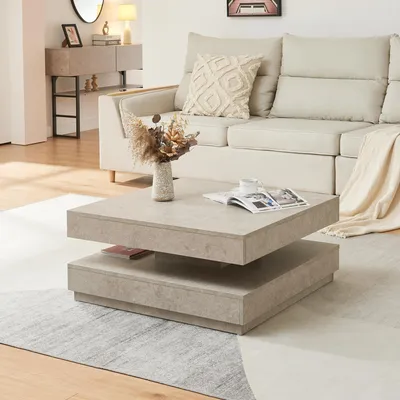 A living room scene with a couch, coffee table, and rug.