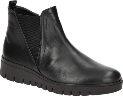 A studio shot of a black leather Chelsea boot.