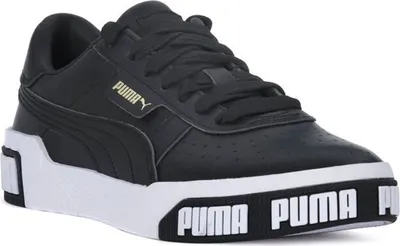 A black Puma sneaker with a white sole and gold Puma logo.